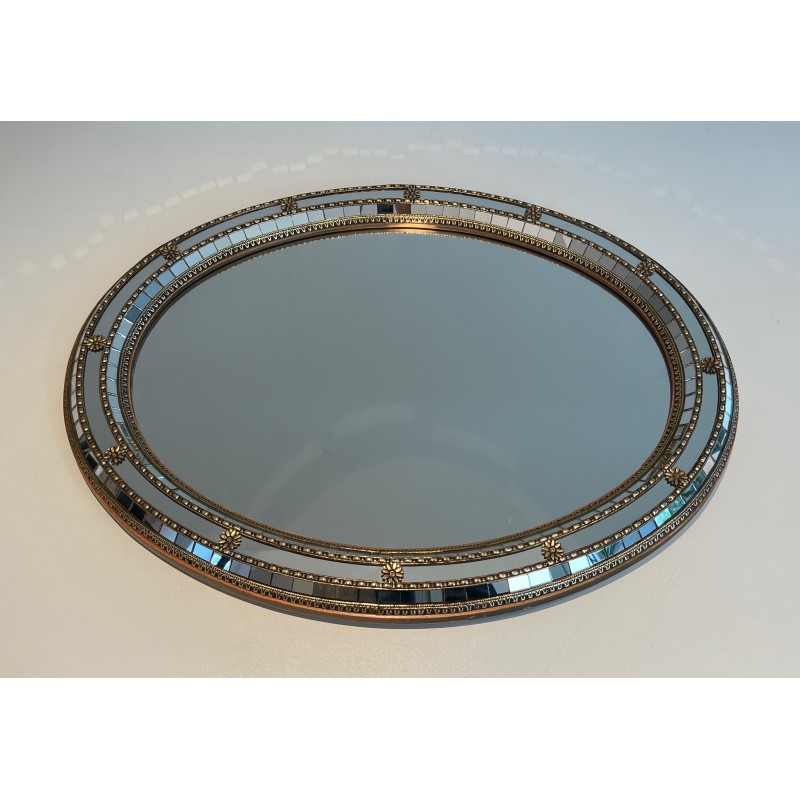 Vintage oval mirror with multi-faceted mirrors and brass garlands, France 1970