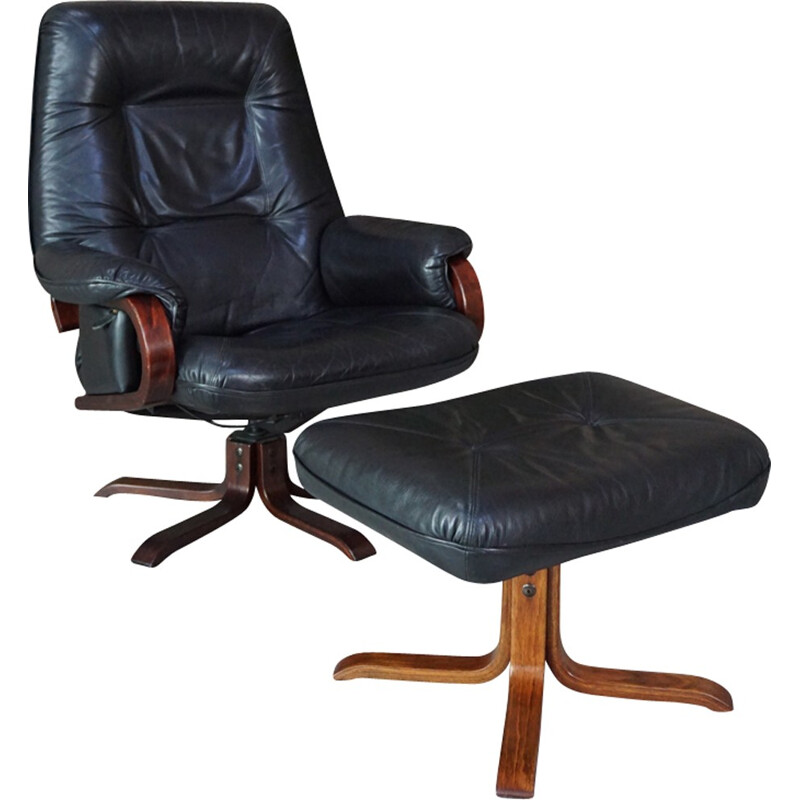 Leather tilting armchair with ottoman - 1970s