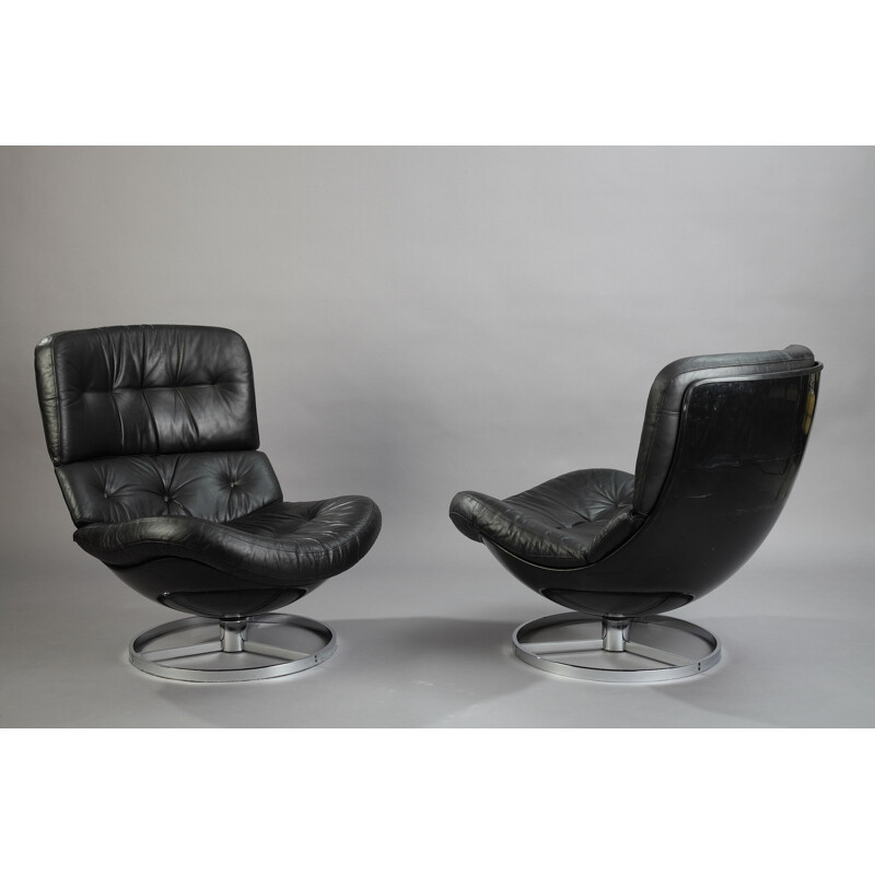 Pair of armchairs and a footrest in fiberglass and leather - 1970s