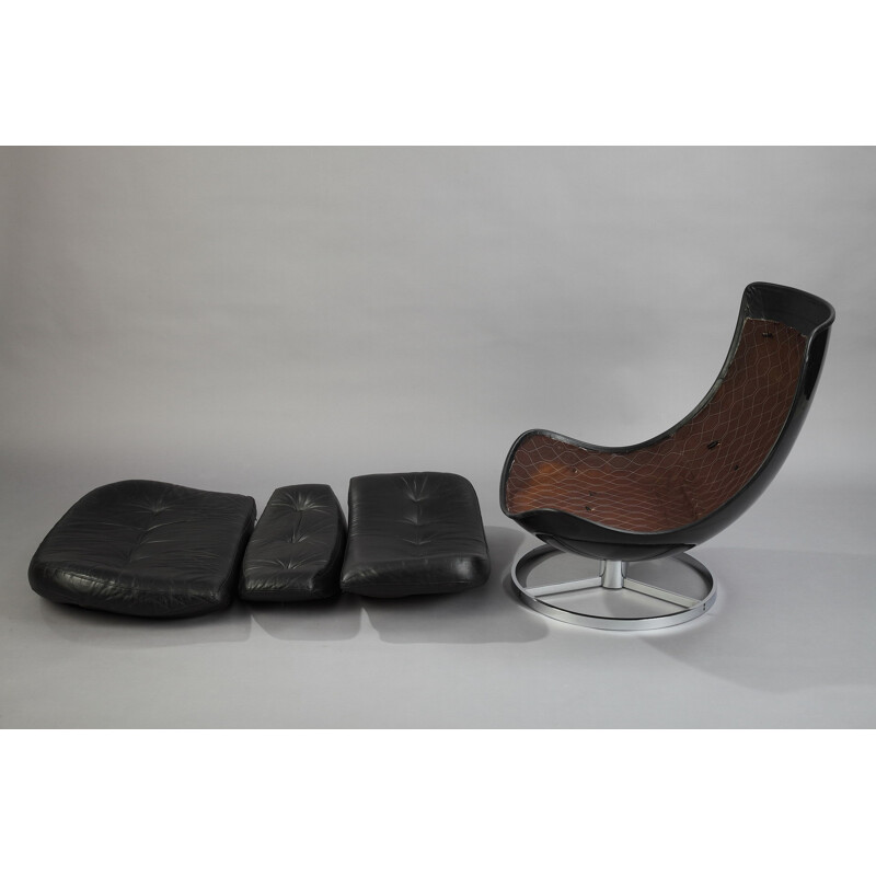 Pair of armchairs and a footrest in fiberglass and leather - 1970s