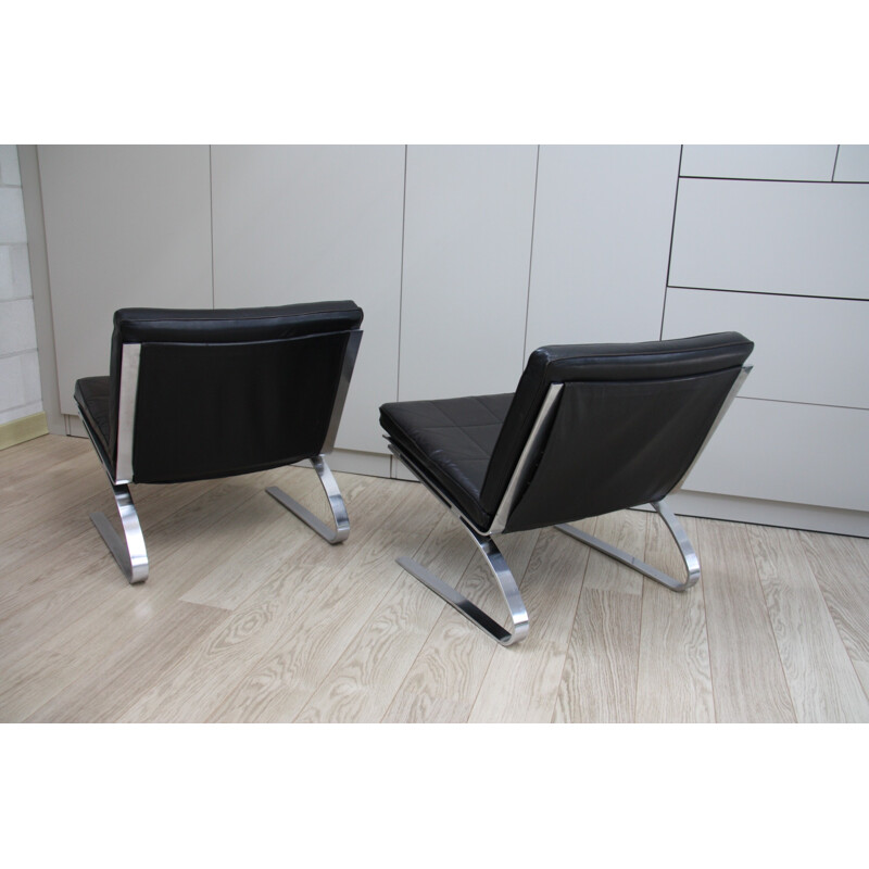 Pair of vintage black leather chairs produced by Girsberger - 1970s