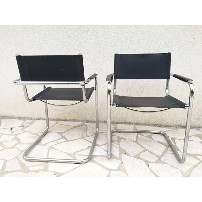A pair of vintage armchairs made of leatherette and chrome - 1970s