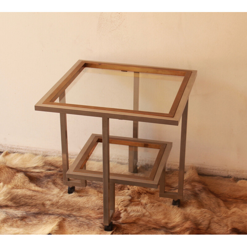 Vintage glass and chromed metal table with double top mounted on casters, 1970