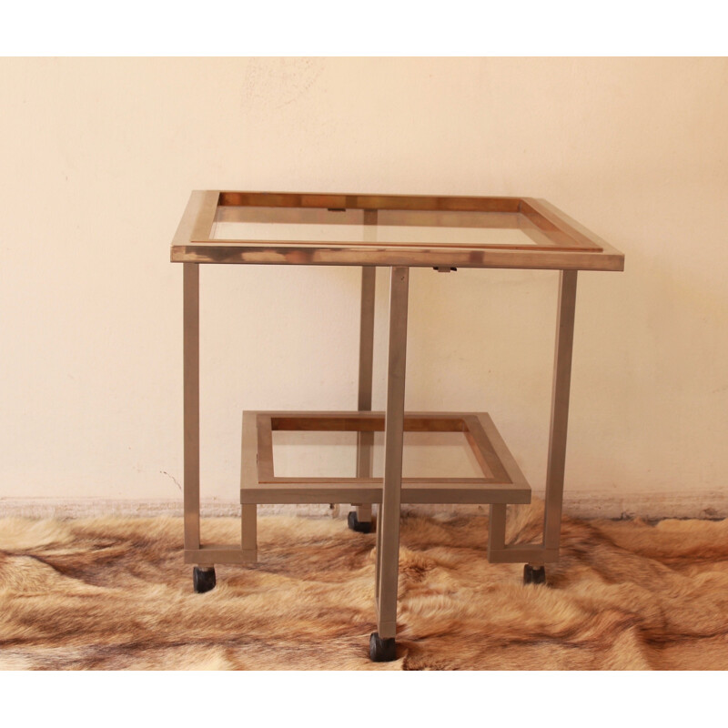 Vintage glass and chromed metal table with double top mounted on casters, 1970