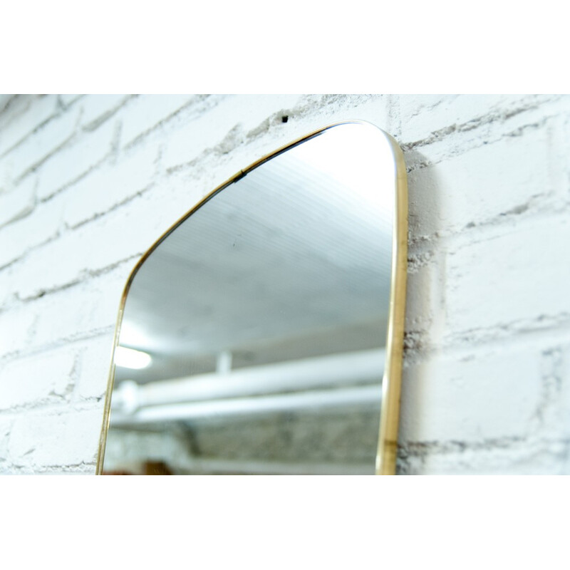 Mid-century asymmetrical brass mirror