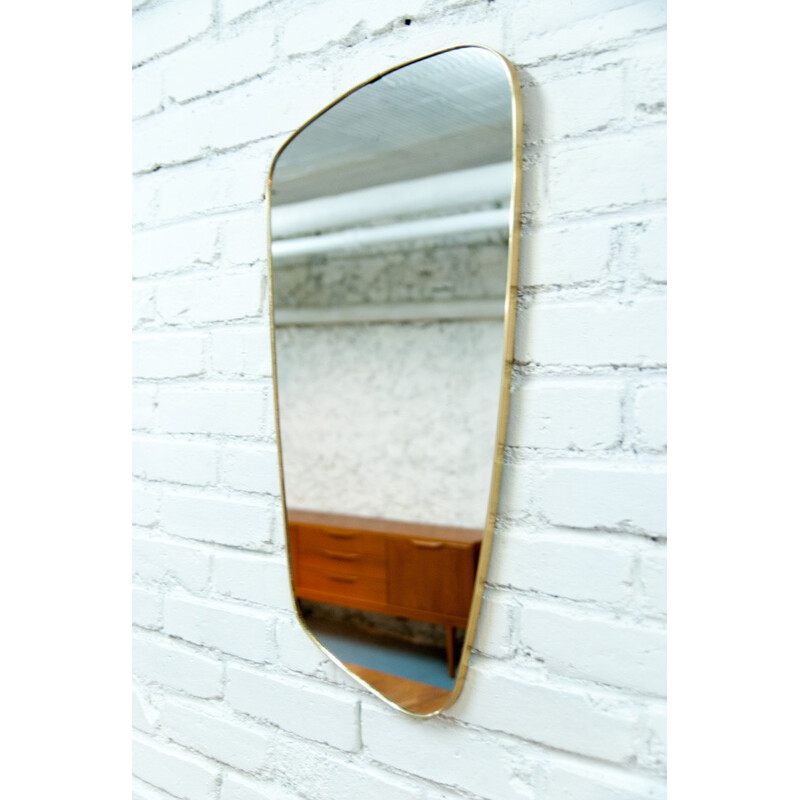 Mid-century asymmetrical brass mirror