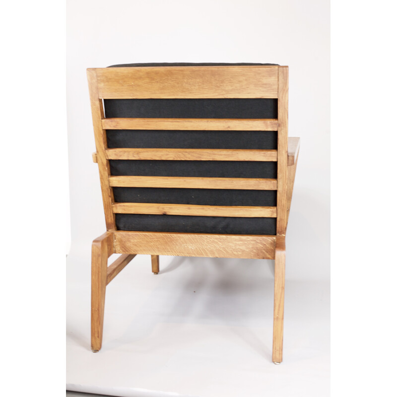 Large black armchair in Oak by René Gabriel - 1940s