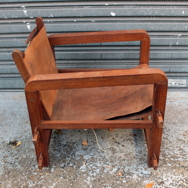 Set of 4 vintage armchairs in solid wood and cognac leather - 1950s