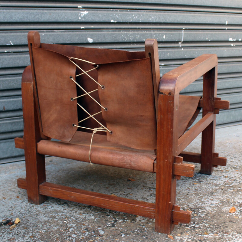 Set of 4 vintage armchairs in solid wood and cognac leather - 1950s