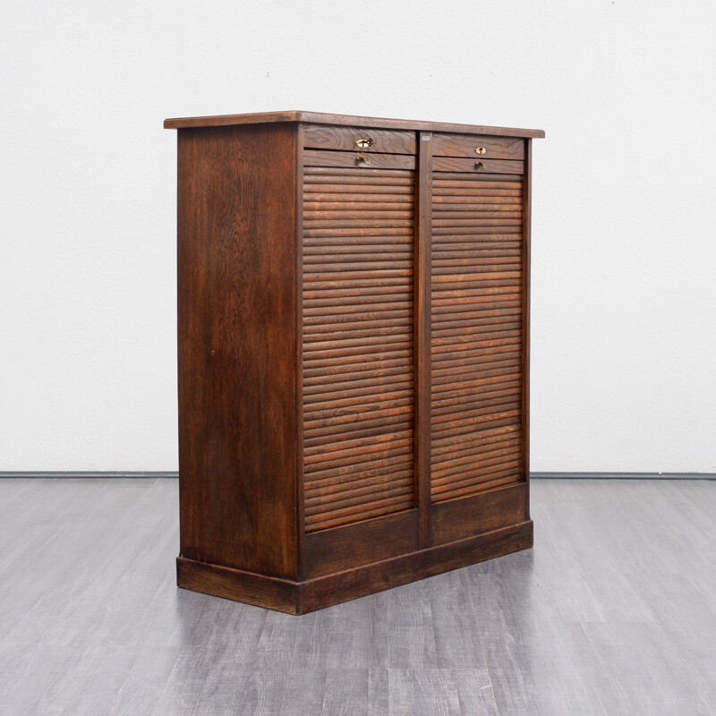 Vintage roller shutter cabinet in dark oak - 1940s