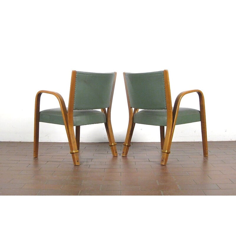 Suite de 4 fauteuils verts modèle "Bow Wood" par Hugues Steiner - 1950