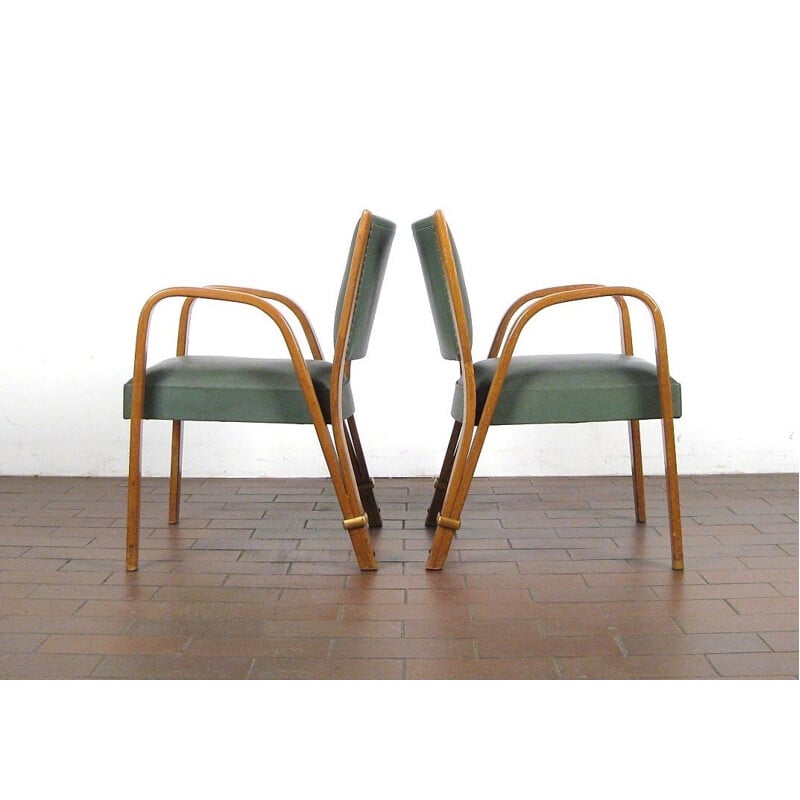 Suite de 4 fauteuils verts modèle "Bow Wood" par Hugues Steiner - 1950