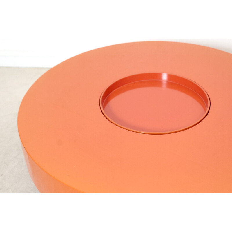 Vintage round table in orange lacquered wood - 1970s