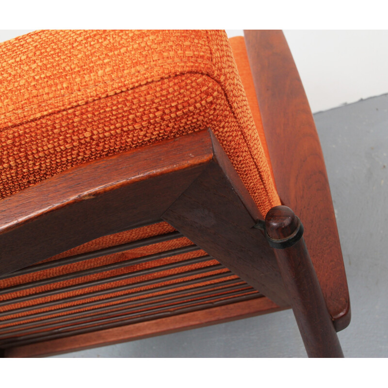 Vintage orange armchair in solid teak - 1960s