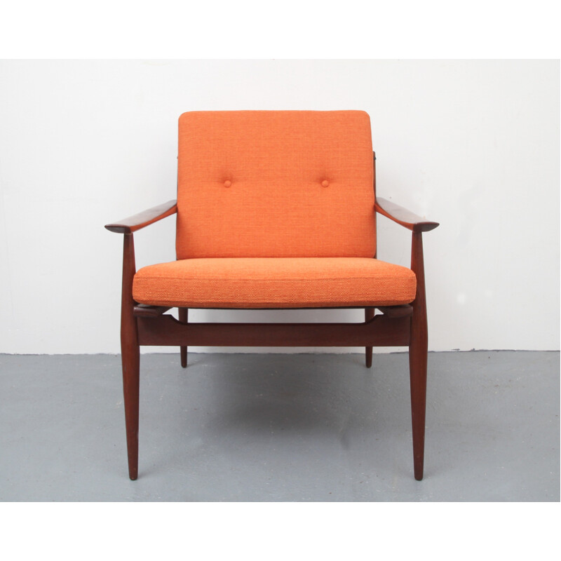 Vintage orange armchair in solid teak - 1960s