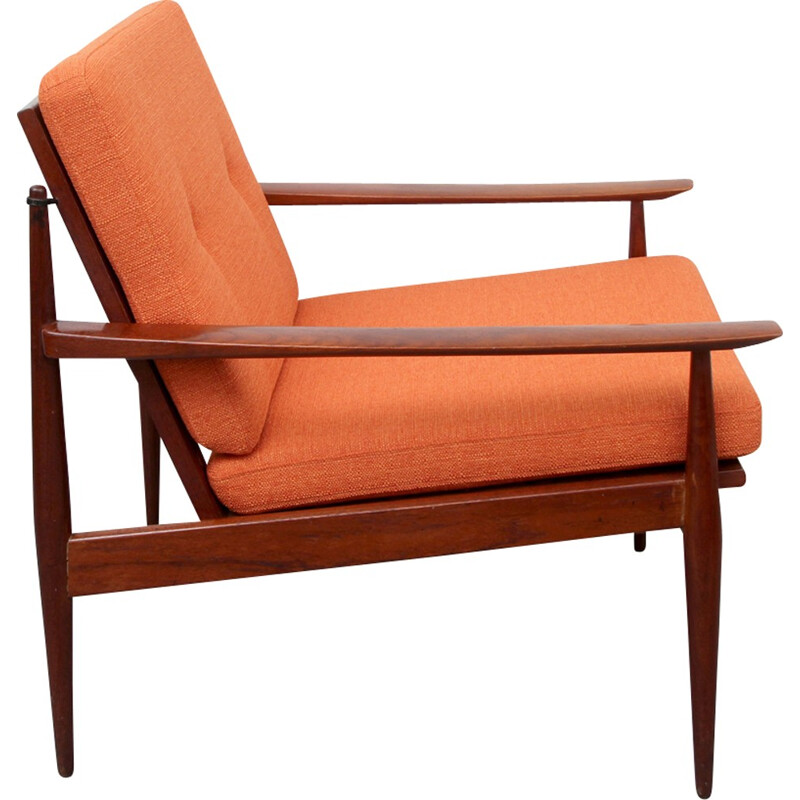 Vintage orange armchair in solid teak - 1960s
