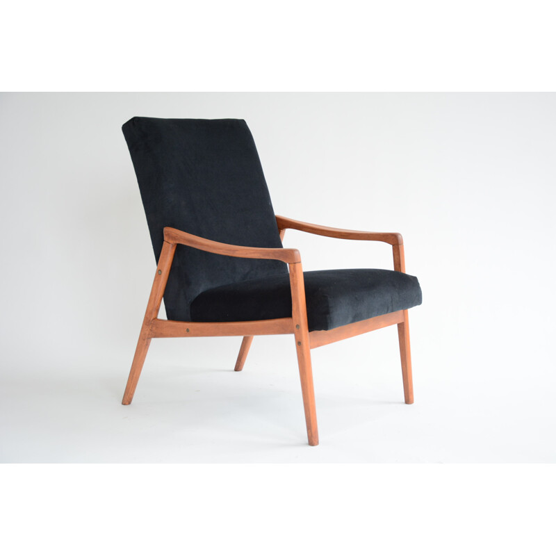 vintage black armchair with an exotic touch - 1960s