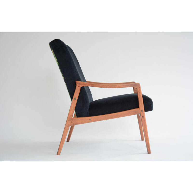 vintage black armchair with an exotic touch - 1960s