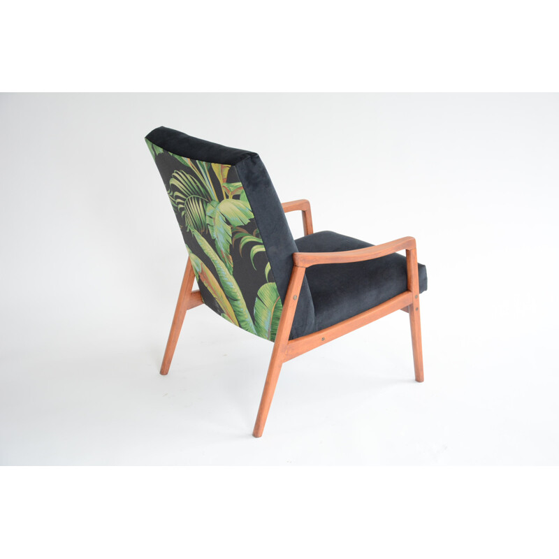 vintage black armchair with an exotic touch - 1960s