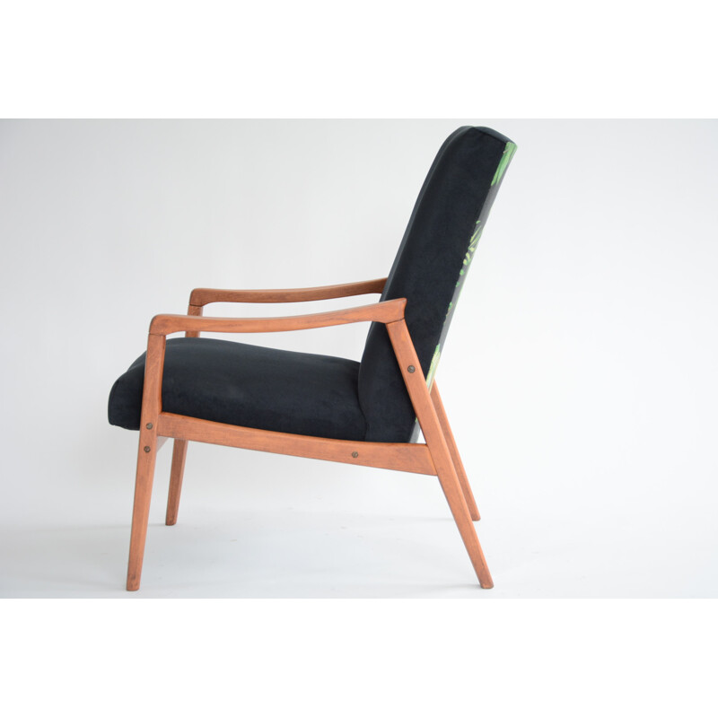 vintage black armchair with an exotic touch - 1960s