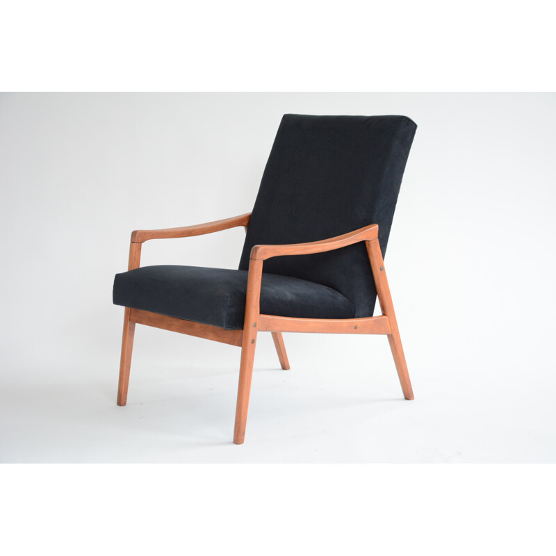 vintage black armchair with an exotic touch - 1960s
