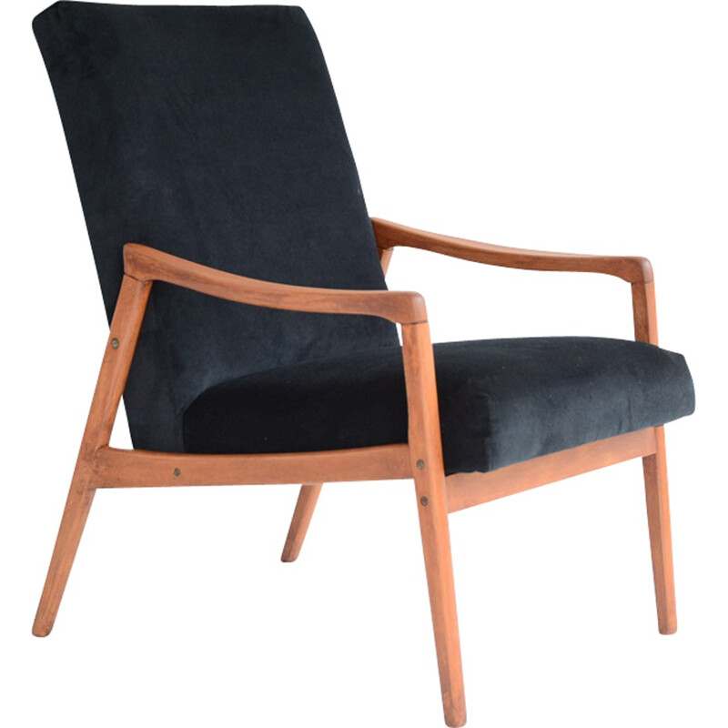 vintage black armchair with an exotic touch - 1960s