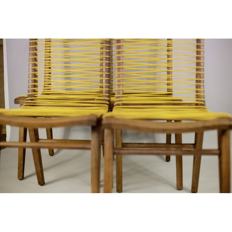 Suite de 4 chaises vintage jaunes francaises en chêne et sadroplast par Louis Sognot - 1955