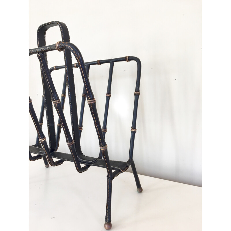 Magazine rack in saddle stitched black leather and brass  by Jacques Adnet - 1950s