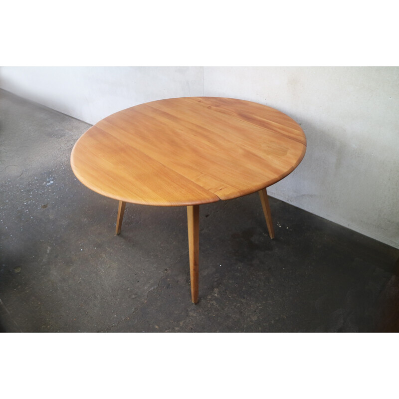 Vintage beech & elm circular drop leaf dining table by Ercol - 1950s