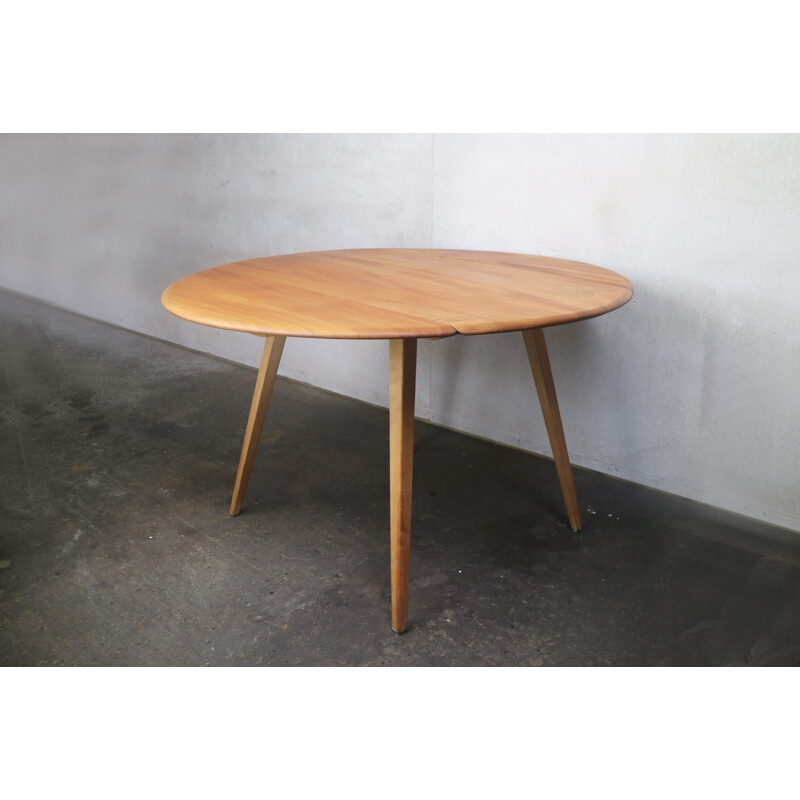 Vintage beech & elm circular drop leaf dining table by Ercol - 1950s