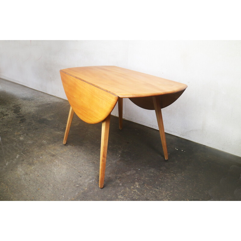 Vintage beech & elm circular drop leaf dining table by Ercol - 1950s