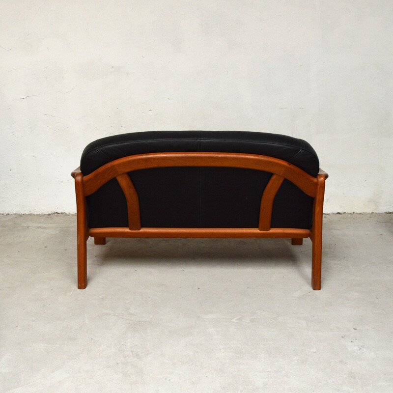Canapé 2 places vintage en teck massif et cuir noir par Arne Wahl Iversen pour Komfort - 1960