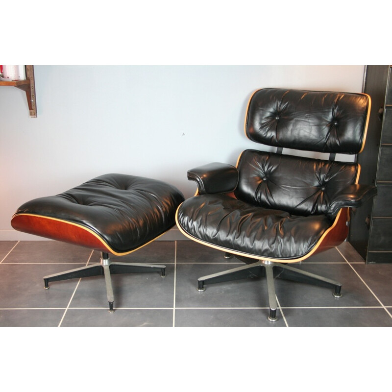 Vintage black lounge chair and ottoman in cherrywood by Eames for Herman Miller - 2000s