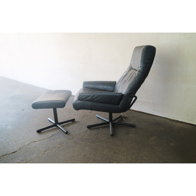 Vintage danish black leather reclining armchair and footstool - 1970s