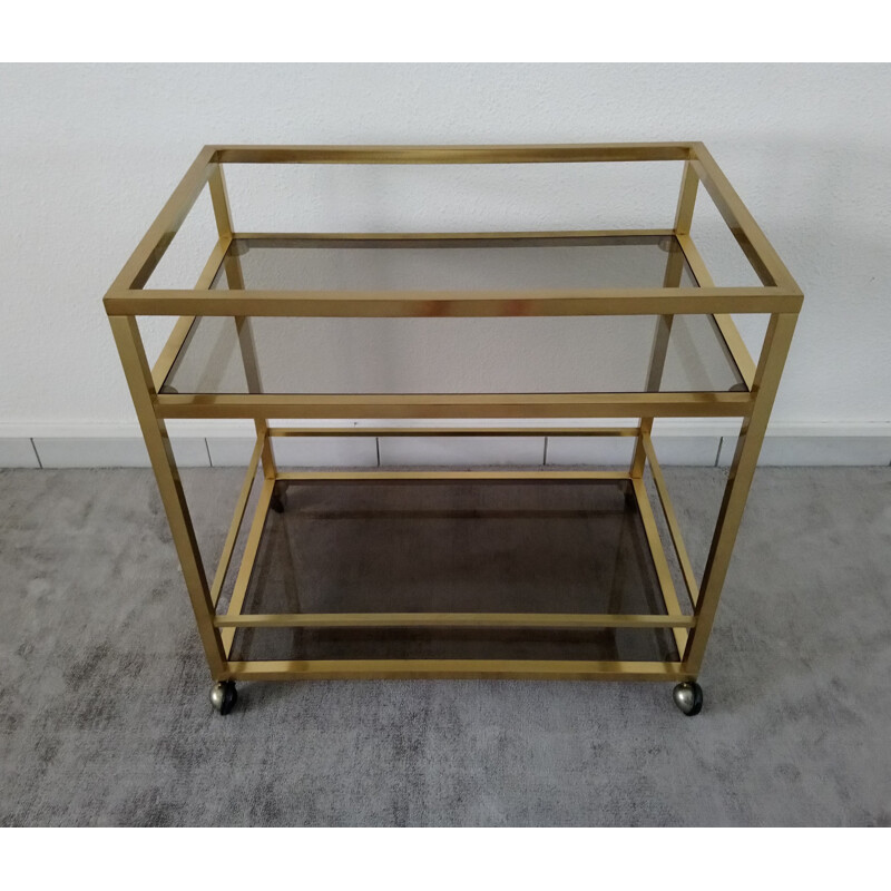 Vintage rolling trolley in golden brass and smoked glass - Italian design - 1970s
