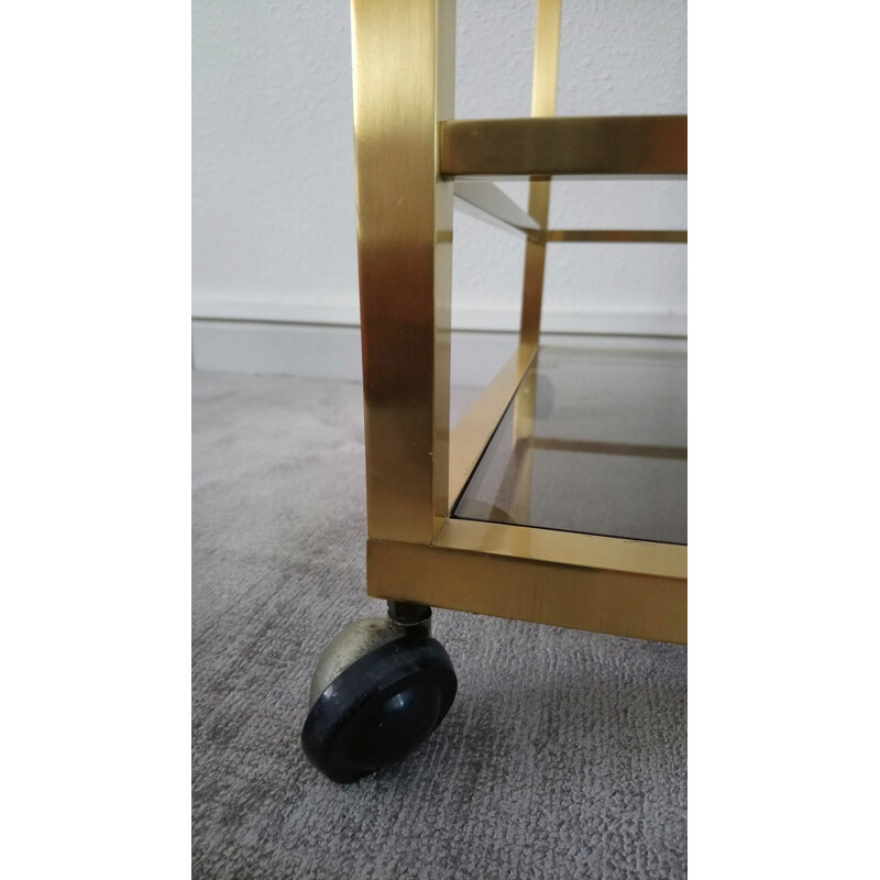 Vintage rolling trolley in golden brass and smoked glass - Italian design - 1970s