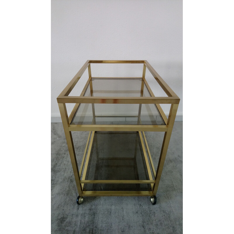 Vintage rolling trolley in golden brass and smoked glass - Italian design - 1970s