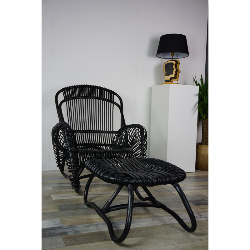 Vintage French armchair and ottoman in rattan.