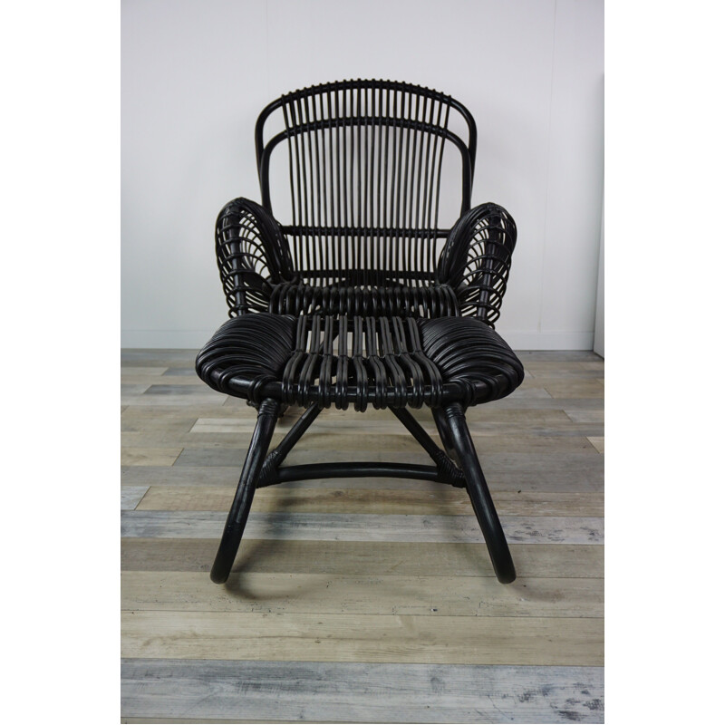 Vintage French armchair and ottoman in rattan.