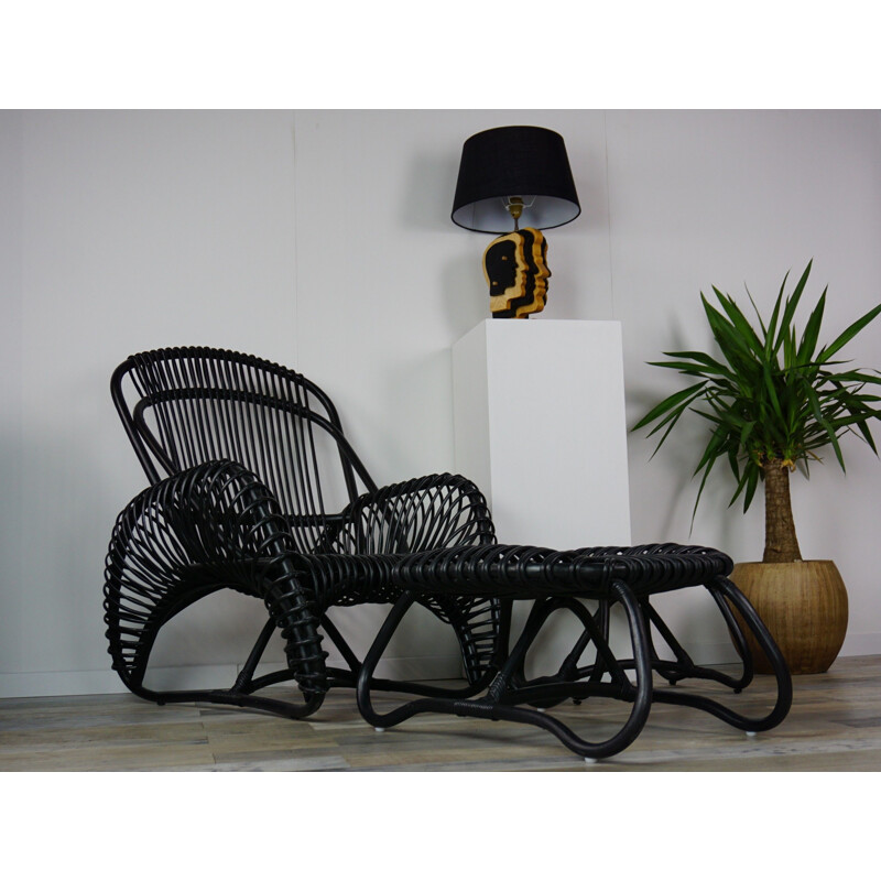 Vintage French armchair and ottoman in rattan.