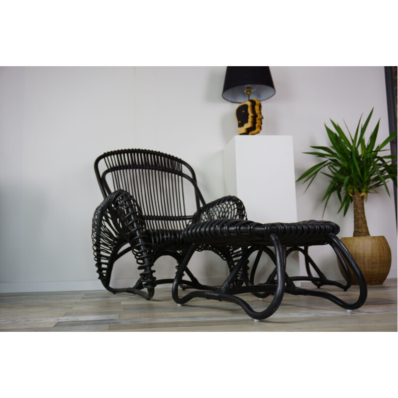 Vintage French armchair and ottoman in rattan.
