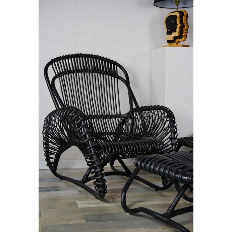 Vintage French armchair and ottoman in rattan.