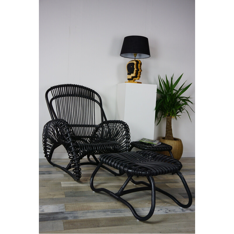 Vintage French armchair and ottoman in rattan.