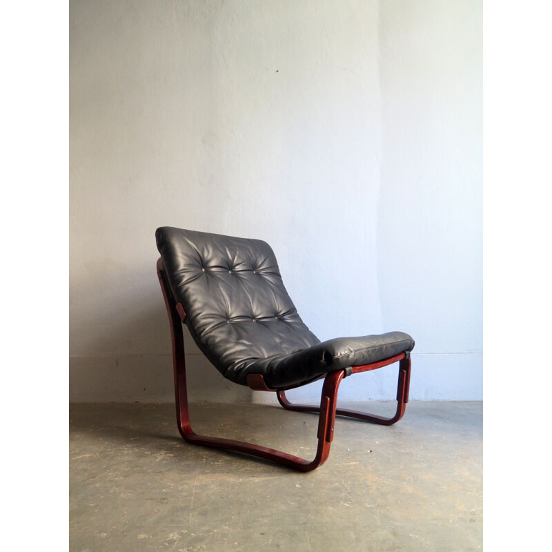 Vintage lounge chair in black leather