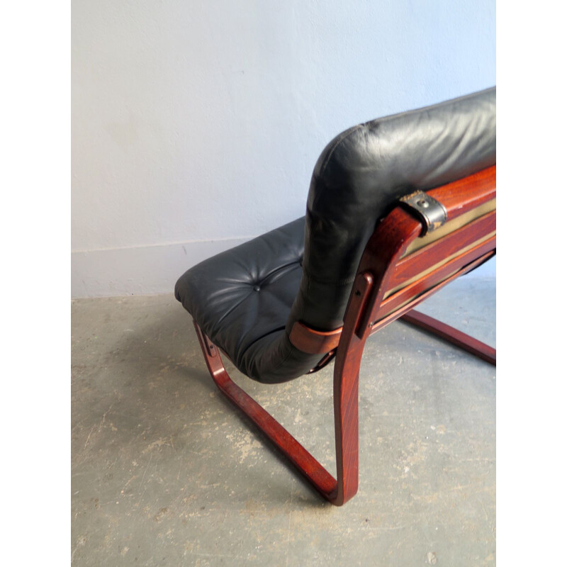 Vintage lounge chair in black leather