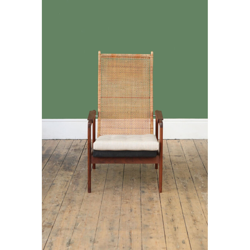 Vintage armchair with high back in rattan by P.J. Muntendam