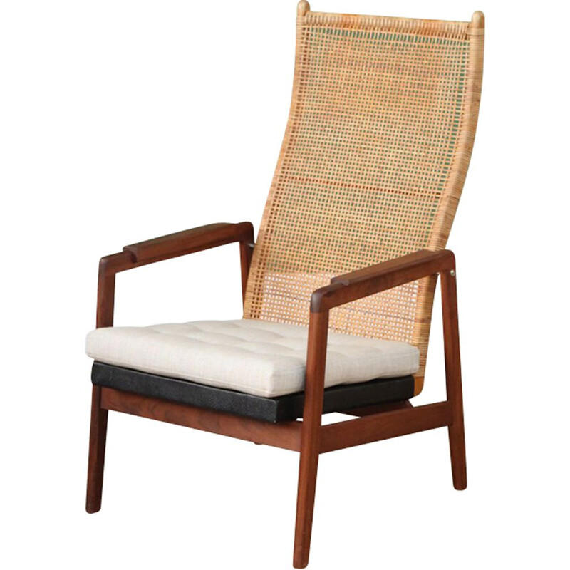 Vintage armchair with high back in rattan by P.J. Muntendam