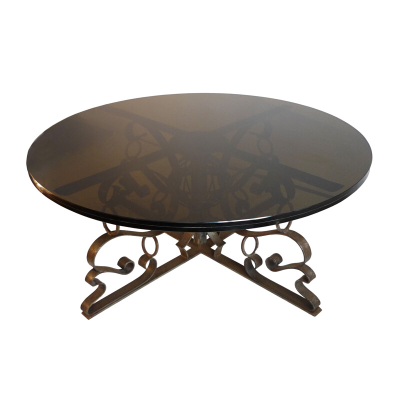 Table basse vintage ronde en acier forgé et plateau de verre fumé