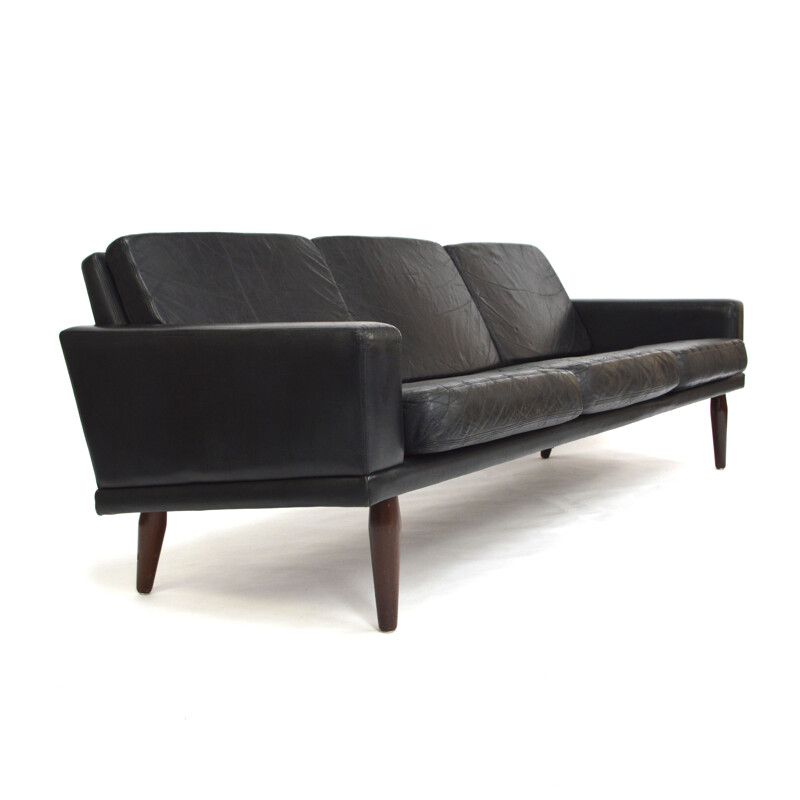 Living room set in black leather and teak by Bovenkamp