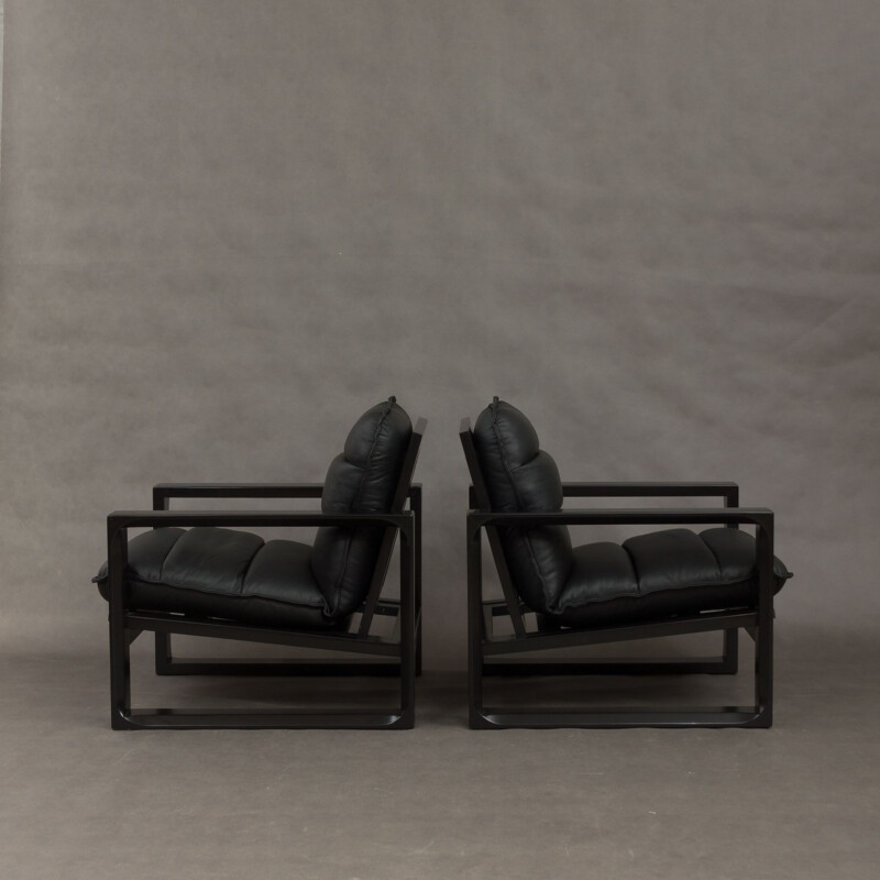 Set of 2 black lounge chairs in wood and leather by Miroslav Navratil